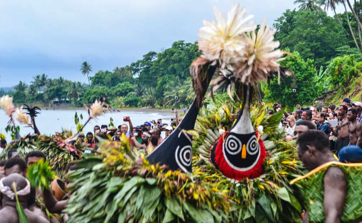 A group of people dressed up in traditional fijian attire.