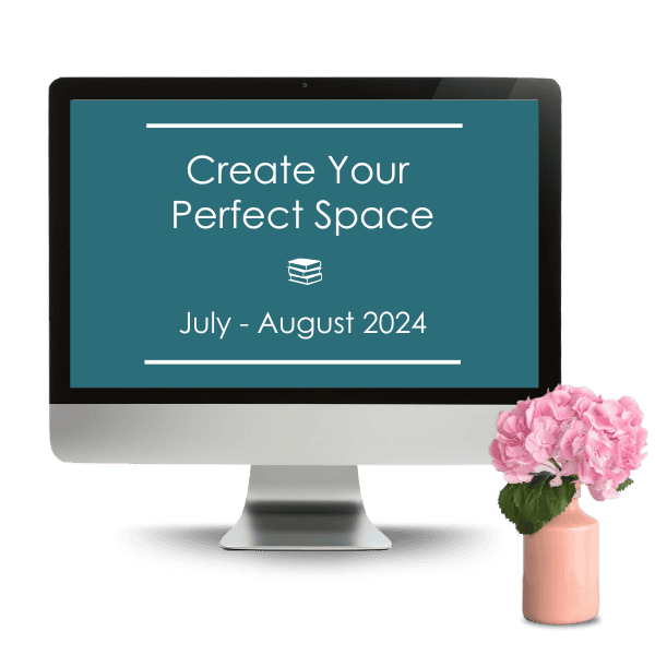 Computer monitor displaying "Create Your Perfect Space, July - August 2024" next to a vase with a pink flower.